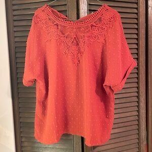 Women’s blouse; pullover style.  Lace all over.  New with tag.  Colour is rust.
